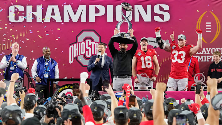 Ohio State Buckeyes head coach Ryan Day hoists the Field Scovell Trophy following the 28-14 win over the Texas Longhorns in the Cotton Bowl Classic College Football Playoff semifinal game at AT&T Stadium in Arlington, Texas on Jan. 10, 2025.