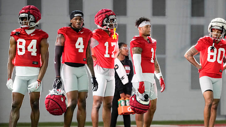 Ohio State Buckeyes wide receivers Dorian Williams (84), Jeremiah Smith (4), Carnell Tate (17), Brandon Inniss (1) and Shawn Lodge (80) watch during spring football practice at the Woody Hayes Athletic Center on March 17, 2025.