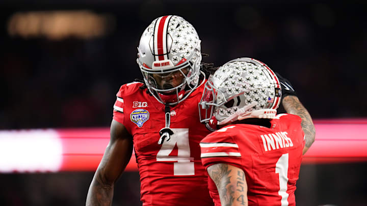 Ohio State Buckeyes wide receiver Brandon Inniss (1) celebrates a touchdown by wide receiver Jeremiah Smith (4) during the Cotton Bowl at AT&T Stadium in Arlington, Texas for the College Football Playoff quarterfinal game against the Miami Hurricanes on Dec. 31, 2025. Ohio State lost 24-14.