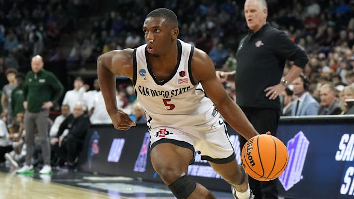Mar 22, 2024; Spokane, WA, USA; San Diego State Aztecs guard Lamont Butler (5) drives to the basket
