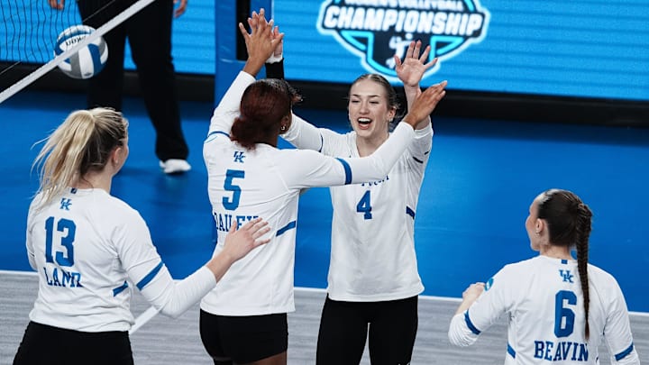 Kentucky's Emma Grome (4) celebrated a point against Cleveland State with teammate Jordyn Dailey (5) during the NCAA Women's Volleyball Tournament at Memorial Coliseum in Lexington, Ky. on Dec. 5, 2024.