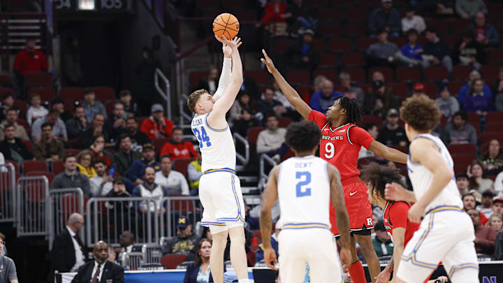 Mar 12, 2026; Chicago, IL, USA; UCLA Bruins forward Tyler Bilodeau (34) shoots against the Rutgers Scarlet Knights during the first half at United Center. Mandatory Credit: Kamil Krzaczynski-Imagn Images