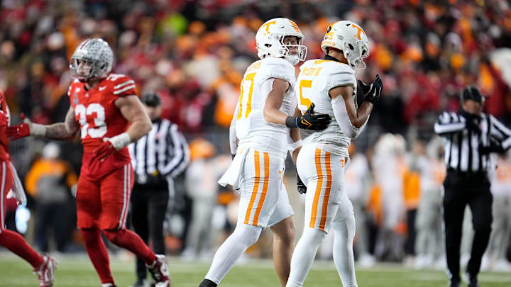 Tennessee Volunteers wide receiver Chris Brazzell II (17) and wide receiver Bru McCoy (5) walk off the field after a failed third down conversion during the second half of the College Football Playoff first round game against the Ohio State Buckeyes at Ohio Stadium in Columbus on Dec. 22, 2024. Ohio State won 42-17.