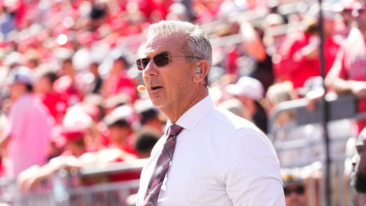 Former Ohio State Buckeyes head coach Urban Meyer, now with Fox Sports, watches on the sideline during the NCAA football game against the Texas Longhorns at Ohio Stadium on Aug. 30, 2025.