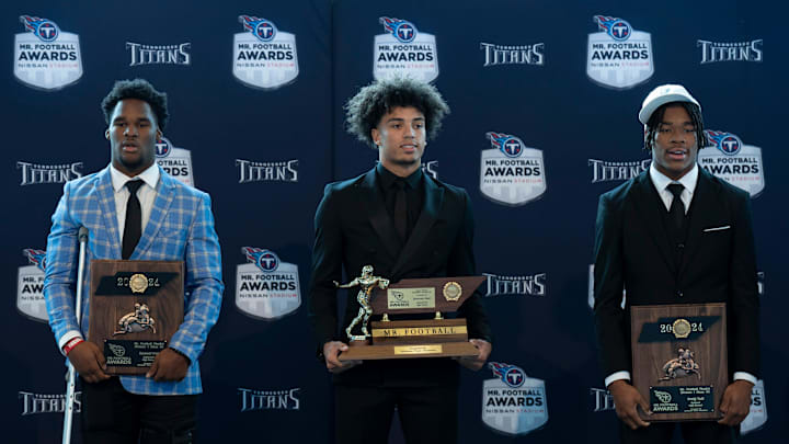 Division I - Class 6A 2024 Tennessee Titans Mr. Football Donovan Starr, Ravenwood High School, center, is flanked by finalists Samuel Iroh, Collierville High School, left, and Craig Tutt, Oakland High School, during the Titans Mr. Football Awards at Nissan Stadium in Nashville, Tenn., Tuesday, Dec. 10, 2024.