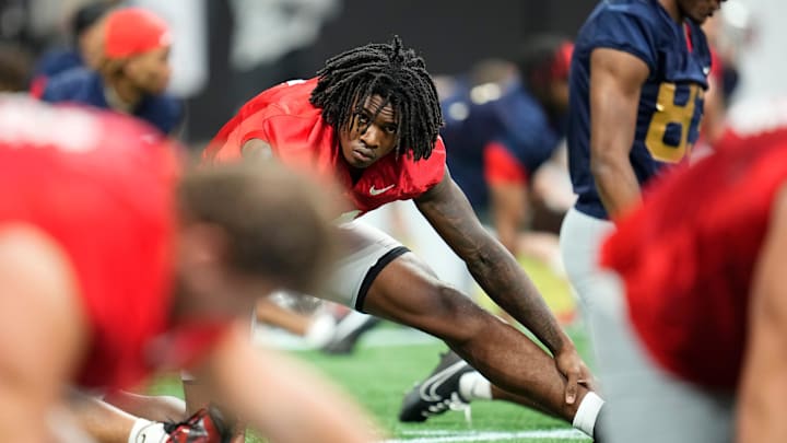 Ohio State Buckeyes wide receiver Jeremiah Smith (4) stretches during practice for the College Football Playoff against the Notre Dame Fighting Irish at the Mercedes-Benz Stadium in Atlanta on Jan. 18, 2025.
