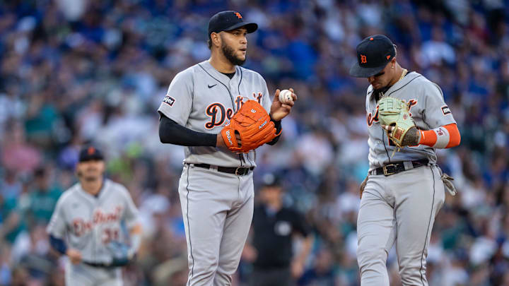 Jul 14, 2023; Seattle, Washington, USA; Detroit Tigers starting pitcher Eduardo Rodriguez (57) meets at the mound with shortstop Javier Baez (28) during a game against the Seattle Mariners at T-Mobile Park. Mandatory Credit: Stephen Brashear-Imagn Images
