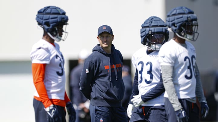 May 9, 2025; Lake Forest, IL, USA; Chicago Bears head coach Ben Johnson (second from left) looks on during the Rookie Minicamp at Halas Hall. Mandatory Credit: Kamil Krzaczynski-Imagn Images