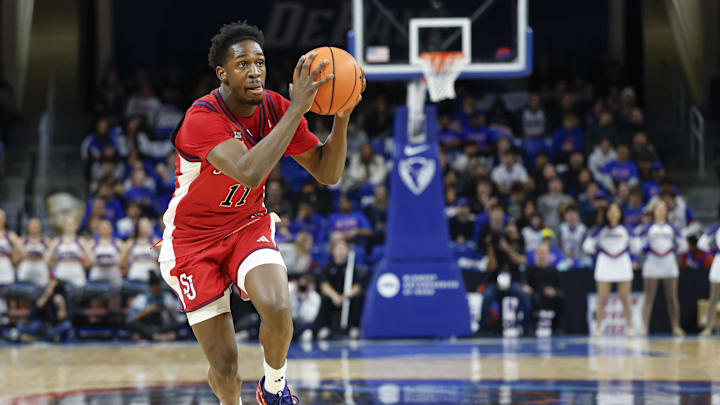 Feb 3, 2026; Chicago, Illinois, USA; St. John's basketball guard Ian Jackson (11) drives to the basket against the DePaul Blue Demons during the first half at Wintrust Arena. Feb 3, 2026; Chicago, Illinois, USA; St. John's basketball guard Ian Jackson (11) drives to the basket against the DePaul Blue Demons during the first half at Wintrust Arena.