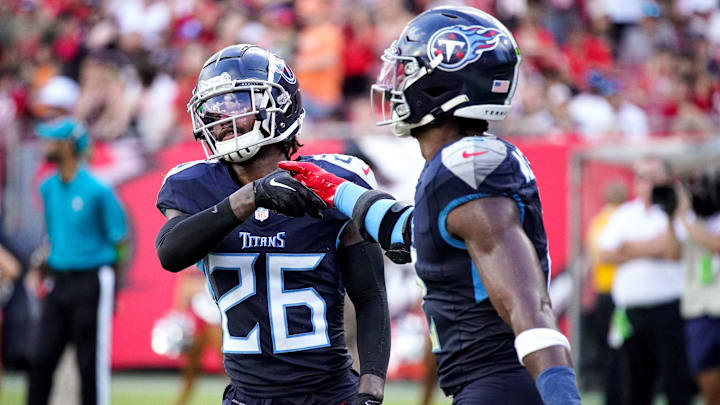 Tennessee Titans cornerback Kristian Fulton (26) and linebacker Azeez Al-Shaair (2) celebrate