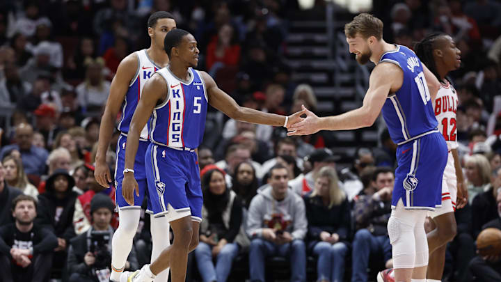Feb 3, 2024; Chicago, Illinois, USA; Sacramento Kings guard De'Aaron Fox (5) celebrates with forward Domantas Sabonis (10) after scoring against the Chicago Bulls during the first half at United Center. Mandatory Credit: Kamil Krzaczynski-USA TODAY Sports
