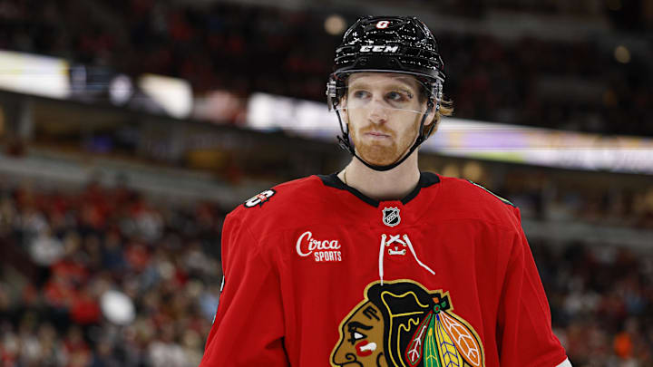 Oct 26, 2025; Chicago, Illinois, USA; Chicago Blackhawks defenseman Sam Rinzel (6) looks on during the first period of an NHL game against the Los Angeles Kings at United Center. Mandatory Credit: Kamil Krzaczynski-Imagn Images
