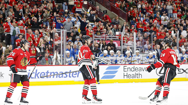 Apr 11, 2026; Chicago, Illinois, USA; Chicago Blackhawks center Ryan Greene (20) reacts after scoring against the St. Louis Blues during the first period at United Center. Mandatory Credit: Kamil Krzaczynski-Imagn Images
