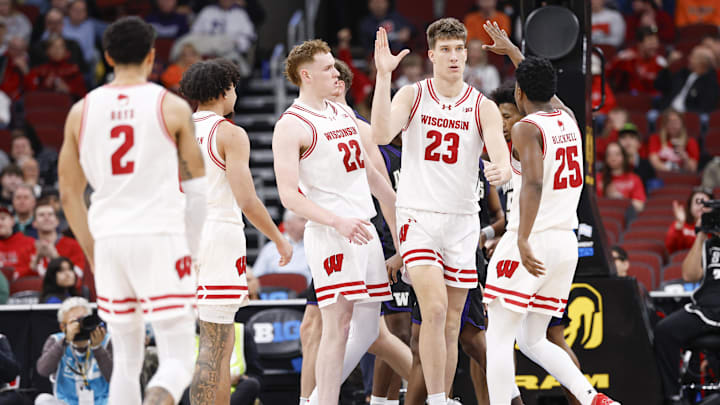 Mar 12, 2026; Chicago, IL, USA; Wisconsin Badgers forward Will Garlock (23) celebrates with teammates after scoring against the Washington Huskies during the first half at United Center. 