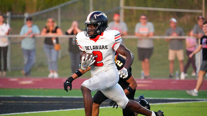 Sep 13, 2024; Sunbury, Ohio, USA; Delaware Hayes Favour Akih (2) runs the ball in for a touchdown against Big Walnut in the first half at Big Walnut High School.