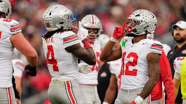 Ohio State Buckeyes wide receiver Jeremiah Smith (4) celebrates a touchdown with running back CJ Donaldson Jr. (12) during the NCAA football game against the Purdue Boilermakers at Ross-Ade Stadium in West Lafayette, Ind. on Nov. 8, 2025.