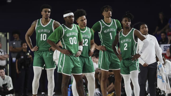 Jan 28, 2024; Boca Raton, Florida, USA; North Texas Mean Green forward Robert Allen (10), guard John Buggs III (00), guard CJ Noland (22), forward Aaron Scott (1), and guard Jason Edwards (2) look on from the court against the Florida Atlantic Owls during the second half at Eleanor R. Baldwin Arena. Mandatory Credit: Sam Navarro-USA TODAY Sports Jan 28, 2024; Boca Raton, Florida, USA; North Texas Mean Green forward Robert Allen (10), guard John Buggs III (00), guard CJ Noland (22), forward Aaron Scott (1), and guard Jason Edwards (2) look on from the court against the Florida Atlantic Owls during the second half at Eleanor R. Baldwin Arena. Mandatory Credit: Sam Navarro-USA TODAY Sports