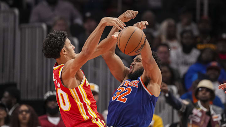 Nov 6, 2024; Atlanta, Georgia, USA; Atlanta Hawks forward Zaccharie Risacher (10) and New York Knicks center Karl-Anthony Towns (32) fight for a rebound during the second half at State Farm Arena. Mandatory Credit: Dale Zanine-Imagn Images Nov 6, 2024; Atlanta, Georgia, USA; Atlanta Hawks forward Zaccharie Risacher (10) and New York Knicks center Karl-Anthony Towns (32) fight for a rebound during the second half at State Farm Arena. Mandatory Credit: Dale Zanine-Imagn Images