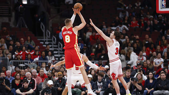 Oct 27, 2025; Chicago, Illinois, USA; Atlanta Hawks center Kristaps Porzingis (8) shoots against Chicago Bulls guard Josh Giddey (3) during the first half at United Center. Mandatory Credit: Kamil Krzaczynski-Imagn Images