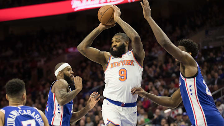 Feb 12, 2018; Philadelphia, PA, USA; New York Knicks center Kyle O'Quinn (9) passes off against Philadelphia 76ers center Joel Embiid (21) during the fourth quarter at Wells Fargo Center. Mandatory Credit: Bill Streicher-Imagn Images Feb 12, 2018; Philadelphia, PA, USA; New York Knicks center Kyle O'Quinn (9) passes off against Philadelphia 76ers center Joel Embiid (21) during the fourth quarter at Wells Fargo Center. Mandatory Credit: Bill Streicher-Imagn Images