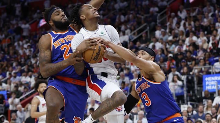 Detroit Pistons forward Ronald Holland II is defended by New York Knicks center Mitchell Robinson and guard Josh Hart. Mandatory Credit: Rick Osentoski-Imagn Images