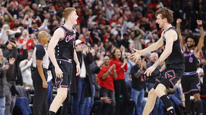 Jan 24, 2026; Chicago, Illinois, USA; Chicago Bulls guard Kevin Huerter (13) celebrates with forward Matas Buzelis (14) after scoring a game winning three-pointer against the Boston Celtics during the second half at United Center. Mandatory Credit: Kamil Krzaczynski-Imagn Images