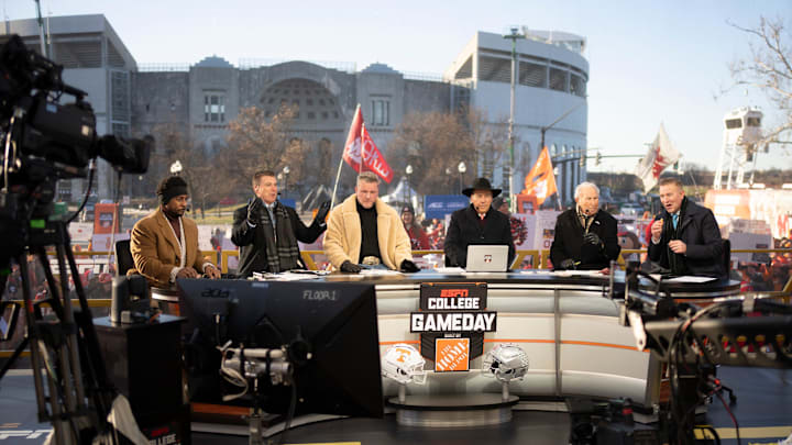 ESPN cast, from left, Desmond Howard, Rece Davis, Pat McAfee, Nick Saban, Lee Corso and Kirk Herbstreit sit on the set of College GameDay prior to the College Football Playoff first round game between the Ohio State Buckeyes and Tennessee Volunteers in Columbus on Dec. 21, 2024.