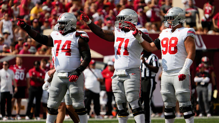 Sep 2, 2023; Bloomington, Indiana, USA; Ohio State Buckeyes offensive lineman Donovan Jackson (74), offensive lineman Josh Simmons (71) and offensive lineman Luke Montgomery (98) set up for a play during the NCAA football game at Indiana University Memorial Stadium. Ohio State won 23-3.
