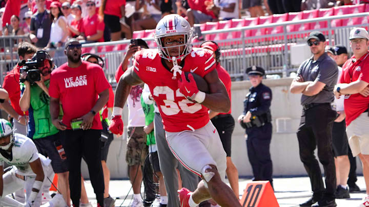 Ohio State Buckeyes running back TreVeyon Henderson (32) runs the ball