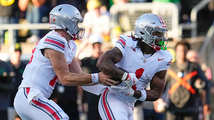 Oct 12, 2024; Eugene, Oregon, USA; Ohio State Buckeyes quarterback Will Howard (18) hands off to running back Quinshon Judkins (1) during the first half of the NCAA football game against the Oregon Ducks at Autzen Stadium