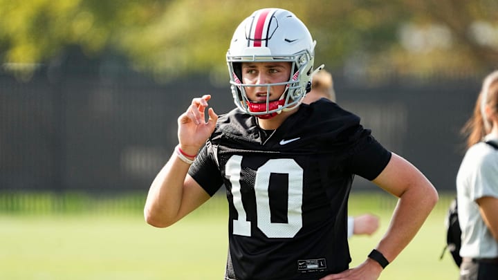 Aug 1, 2024; Columbus, OH, USA; Ohio State Buckeyes quarterback Julian Sayin (10) motions during football camp at the Woody Hayes Athletic Complex.