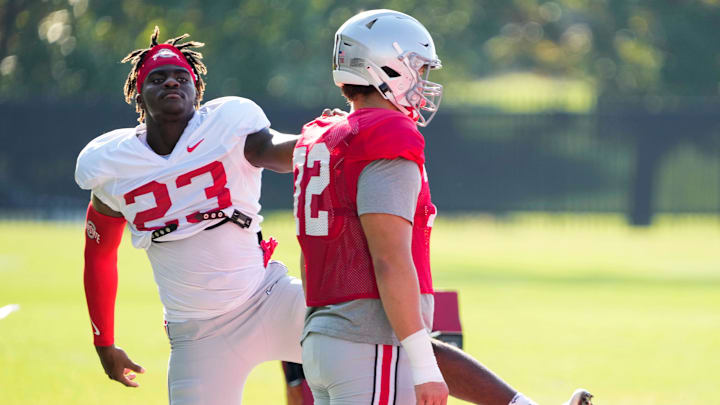 Aug 11, 2022; Columbus, OH, USA;  Ohio State Buckeyes defensive end Omari Abor (23) stretches with offensive lineman Avery Henry (72) during football camp at the Woody Hayes Athletic Center. Mandatory Credit: Adam Cairns-The Columbus Dispatch

Ohio State Football Camp
