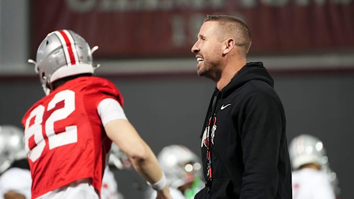 Mar 7, 2024; Columbus, OH, USA; Ohio State Buckeyes co-offensive coordinator Brian Hartline watches players warm up during spring football practice at the Woody Hayes Athletic Center.