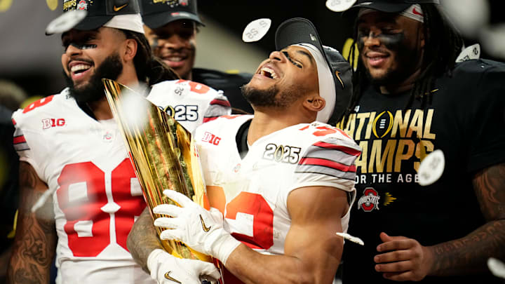 Ohio State Buckeyes running back TreVeyon Henderson (32) celebrates with the trophy following the 34-23 win over the Notre Dame Fighting Irish to win the College Football Playoff National Championship at Mercedes-Benz Stadium in Atlanta on Jan. 22, 2025. Ohio State Buckeyes running back TreVeyon Henderson (32) celebrates with the trophy following the 34-23 win over the Notre Dame Fighting Irish to win the College Football Playoff National Championship at Mercedes-Benz Stadium in Atlanta on Jan. 22, 2025.