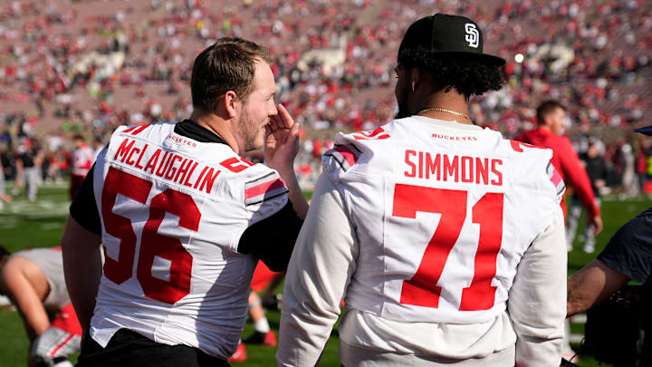 Injured Ohio State Buckeyes offensive linemen Seth McLaughlin (56) and Josh Simmons (71) watch warm ups prior to the College Football Playoff quarterfinal against the Oregon Ducks at the Rose Bowl in Pasadena, Calif. on Jan. 1, 2025. Ohio State won 41-21.