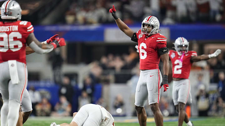 Ohio State Buckeyes safety Sonny Styles (6) celebrates a hit on Texas Longhorns tight end Gunnar Helm (85) during the first half of the Cotton Bowl Classic College Football Playoff semifinal game at AT&T Stadium in Arlington, Texas on Jan. 10, 2025.