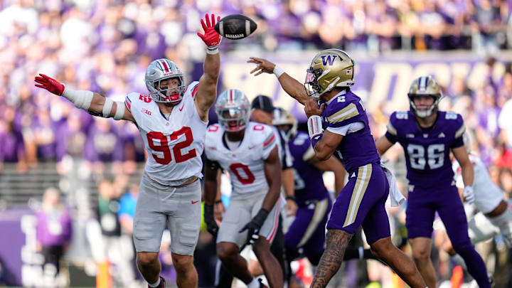 Ohio State Buckeyes defensive end Caden Curry (92) defends Washington Huskies quarterback Demond Williams Jr. (2) during the first half of the NCAA football game at Husky Stadium in Seattle on Sept. 27, 2025. Ohio State Buckeyes defensive end Caden Curry (92) defends Washington Huskies quarterback Demond Williams Jr. (2) during the first half of the NCAA football game at Husky Stadium in Seattle on Sept. 27, 2025.