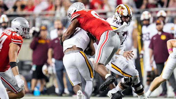 Ohio State Buckeyes linebacker Sonny Styles tackles Minnesota Golden Gophers running back Darius Taylor (1) during the NCAA football game at Ohio Stadium in Columbus on Oct. 4, 2025. Ohio State won 42-3.