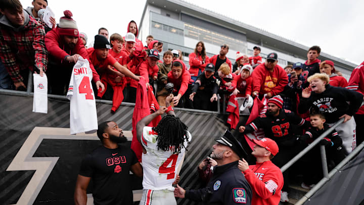 Ohio State Buckeyes wide receiver Jeremiah Smith (4) signs autographs following the NCAA football game against the Purdue Boilermakers at Ross-Ade Stadium in West Lafayette, Ind. on Nov. 8, 2025. Ohio State won 34-10.
