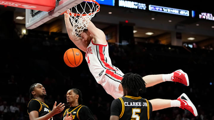 Ohio State Buckeyes forward Brandon Noel (14) dunks over Appalachian State Mountaineers forward Chad Moodie (23), center Luke Wilson (3) and guard Jason Clarke Jr. (5) during the NCAA men's basketball game at Value City Arena in Columbus on Nov. 11, 2025. Ohio State won 75-53.