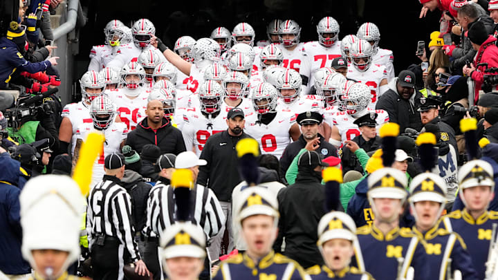 Ohio State Buckeyes head coach Ryan Day leads his team onto the field prior to the NCAA football game against the Michigan Wolverines at Michigan Stadium in Ann Arbor, Mich. on Nov. 29, 2025.