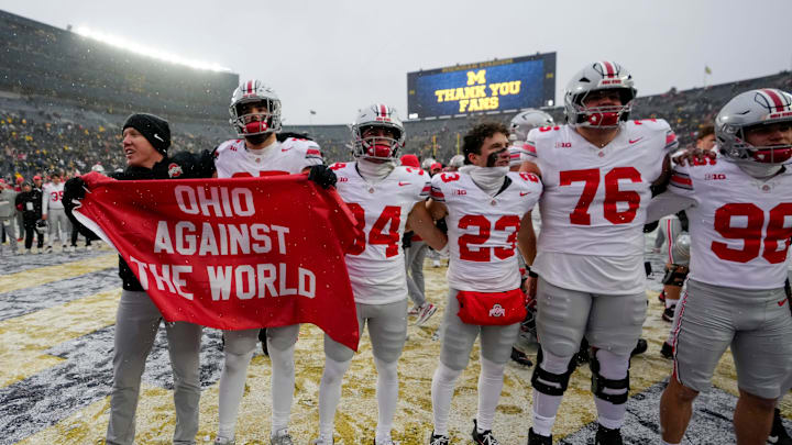 Ohio State Buckeyes players celebrate following the NCAA football game against the Michigan Wolverines at Michigan Stadium in Ann Arbor, Mich. on Nov. 29, 2025. Ohio State won 27-9. Ohio State Buckeyes players celebrate following the NCAA football game against the Michigan Wolverines at Michigan Stadium in Ann Arbor, Mich. on Nov. 29, 2025. Ohio State won 27-9.