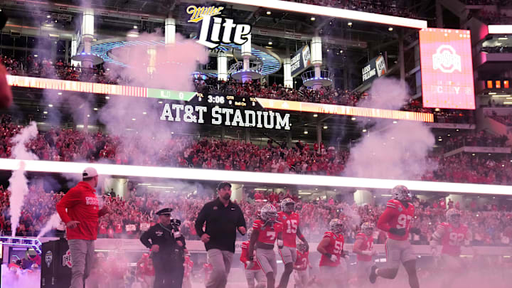 Ohio State Buckeyes head coach Ryan Day leads his team onto the field for the Cotton Bowl at AT&T Stadium in Arlington, Texas for the College Football Playoff quarterfinal game against the Miami Hurricanes on Dec. 31, 2025.