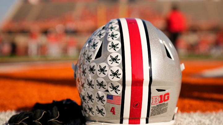 Ohio State Buckeyes wide receiver Jeremiah Smith's helmet sits on the sideline as the team warms up prior to the NCAA football game against the Illinois Fighting Illini at Gies Memorial Stadium in Champaign on Oct. 11, 2025.