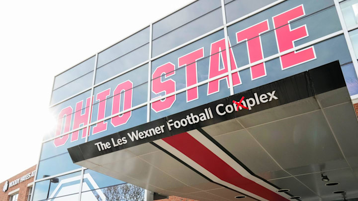 Sexual abuse survivors by former Ohio State University doctor Richard Strauss gather outside the Woody Hayes Athletic Center to call for Les Wexner's name to be removed from the facility during a press conference on Dec. 17, 2025. The building is also named The Les Wexner Football Complex.