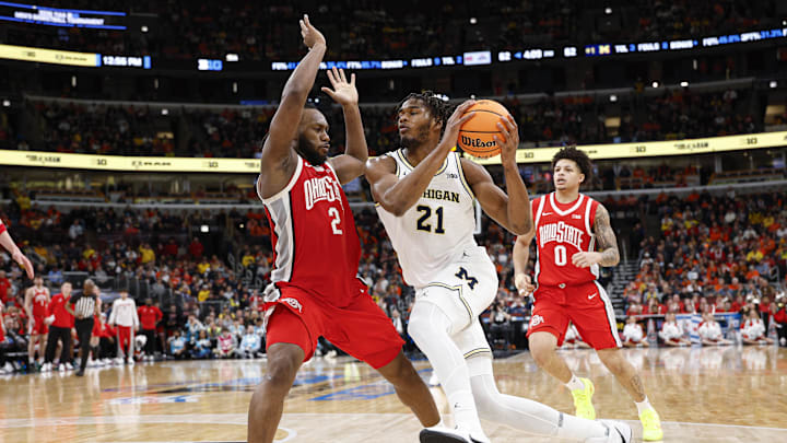 Mar 13, 2026; Chicago, IL, USA; Michigan Wolverines forward Morez Johnson Jr. (21) drives to the basket against Ohio State Buckeyes guard Bruce Thornton (2) during the second half at United Center. Mandatory Credit: Kamil Krzaczynski-Imagn Images