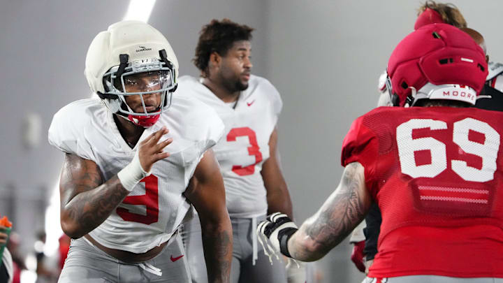 Ohio State Buckeyes defensive end Zion Grady (9) rushes toward offensive lineman Ian Moore (69) during Student Appreciation Day spring practice at the Woody Hayes Athletic Center on April 4, 2026.