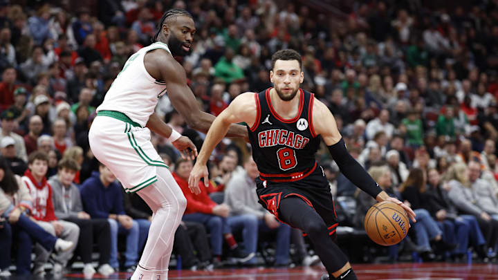 Nov 29, 2024; Chicago, Illinois, USA; Chicago Bulls guard Zach LaVine (8) drives to the basket against Boston Celtics guard Jaylen Brown (7) during the first half at United Center. Mandatory Credit: Kamil Krzaczynski-Imagn Images