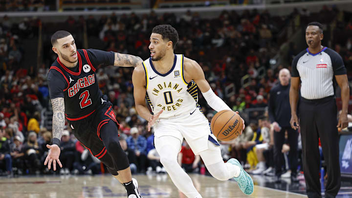  Indiana Pacers guard Tyrese Haliburton (0) drives to the basket against Chicago Bulls guard Lonzo Ball (2) during the first half at United Center. Mandatory Credit: Kamil Krzaczynski-Imagn Images