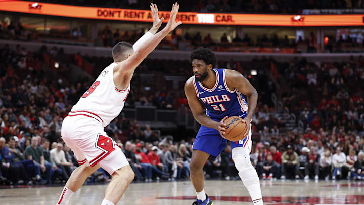 Dec 8, 2024; Chicago, Illinois, USA; Chicago Bulls center Nikola Vucevic (9) defends against Philadelphia 76ers center Joel Embiid (21) during the second half at United Center. Mandatory Credit: Kamil Krzaczynski-Imagn Images Dec 8, 2024; Chicago, Illinois, USA; Chicago Bulls center Nikola Vucevic (9) defends against Philadelphia 76ers center Joel Embiid (21) during the second half at United Center. Mandatory Credit: Kamil Krzaczynski-Imagn Images